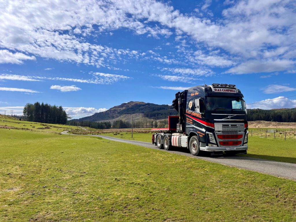 D&J Campbell Volvo Hiab crane lorry on a country road